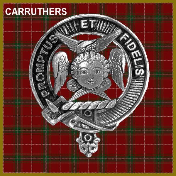 a silver badge with a crest and text, set against a red and green plaid background.