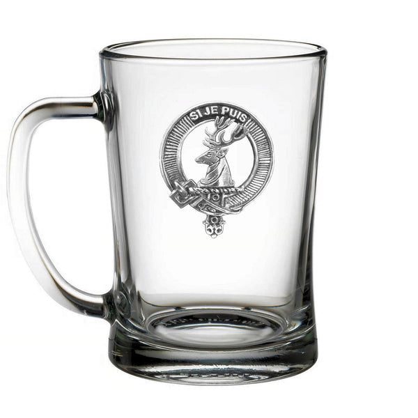 A clear glass mug with an embossed design featuring a deer head and a crest.