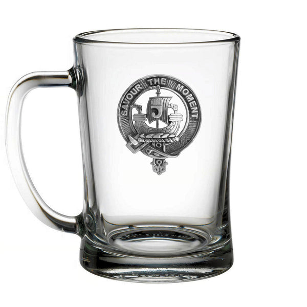 A clear glass mug with an embossed logo on it.