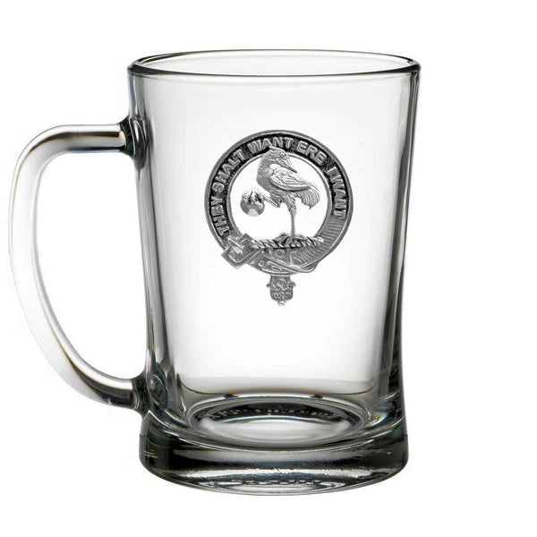 A clear glass mug with an embossed design featuring a bird and text.