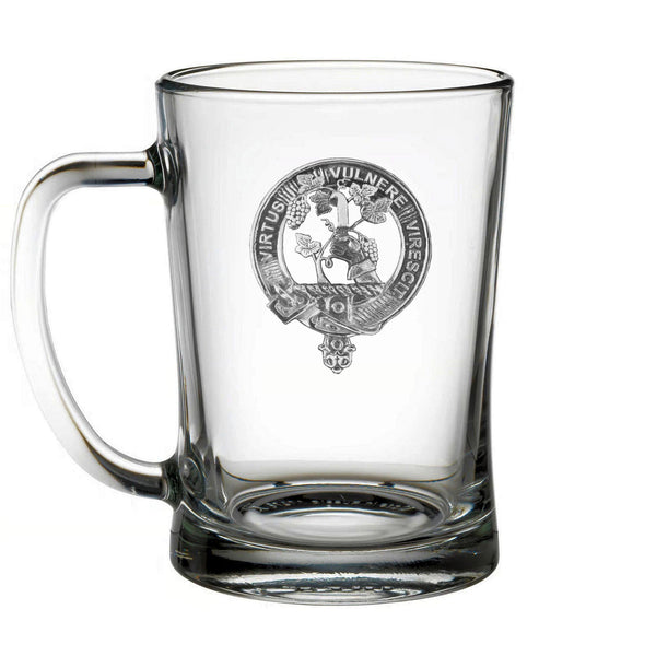 A clear glass mug with an embossed design on it.