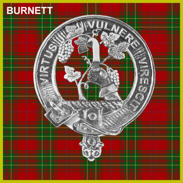 a detailed engraving of a crest or badge with a circular design, surrounded by a band of ribbon or fabric. The background is a plaid pattern in shades of red and green.