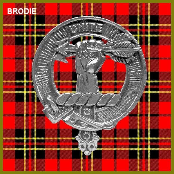 a silver badge with a red and black plaid background.