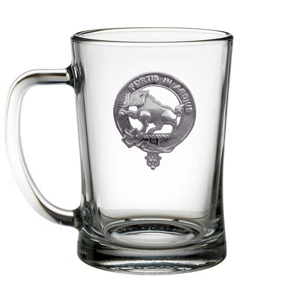 A clear glass mug with a silver emblem featuring a lion and the text "FORTIS IN ARCTIC" printed on it.