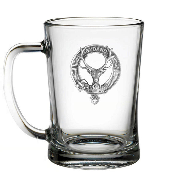 A clear glass mug with a silver emblem featuring a deer head and a crown.