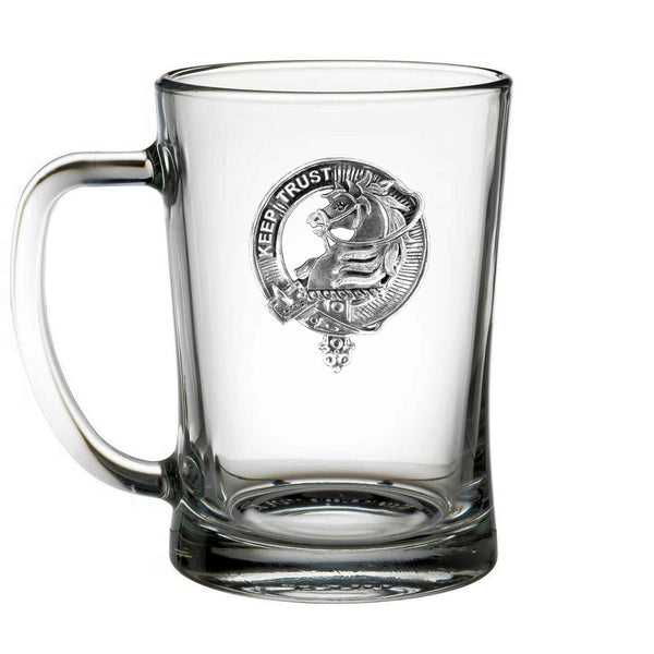 A clear glass mug with an embossed emblem and the text "KEEP TRUST" on it.