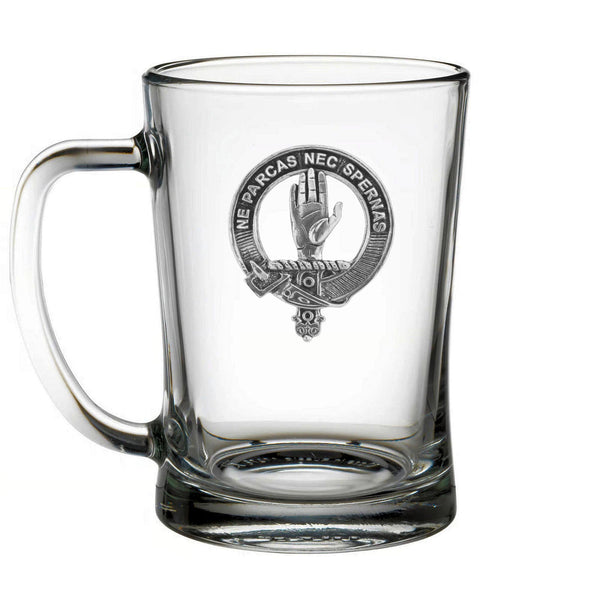 A clear glass mug with an embossed logo on it.