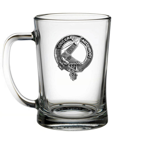 A clear glass mug with an embossed logo on it.