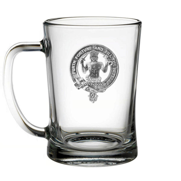 A clear glass mug with an embossed emblem featuring a person and the text "FURTH FORTUNE AND FILL ME" printed on it.