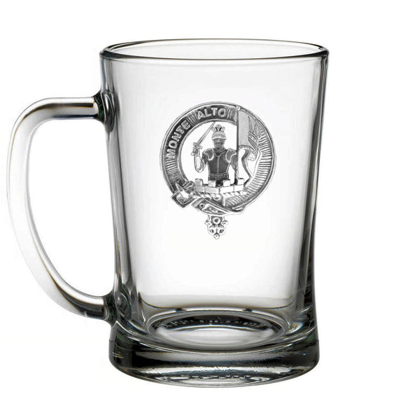 A clear glass mug with an embossed design on it.