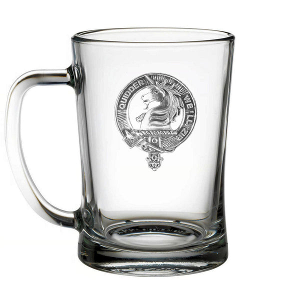 A clear glass mug with an embossed logo on it.