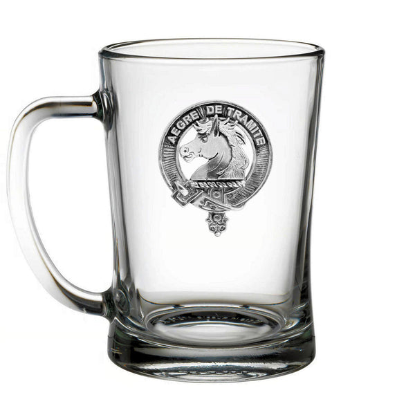 A clear glass mug with an embossed emblem featuring a horse and the text "LEGERE DE TRAMITE" printed on it.