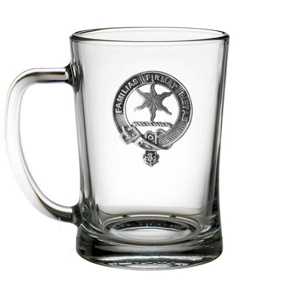 A clear glass mug with an embossed logo on it.
