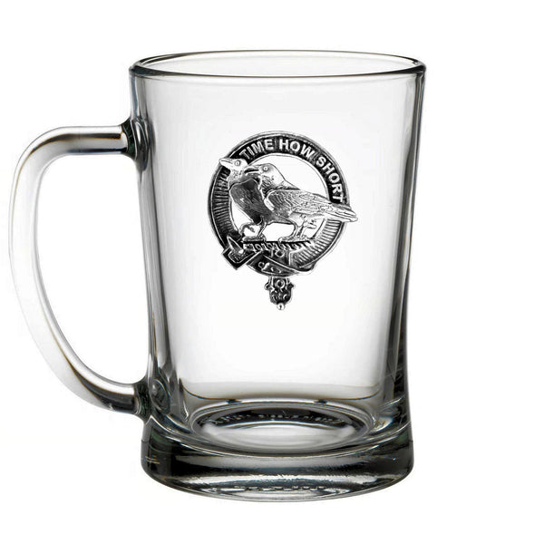 A clear glass mug with a black and white design featuring a bird and the text "Time how short" inside a circular emblem.