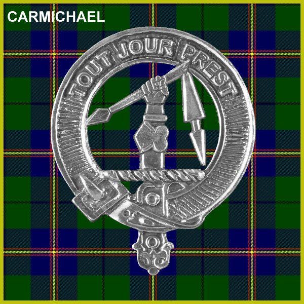 a silver crest or badge with a plaid background.