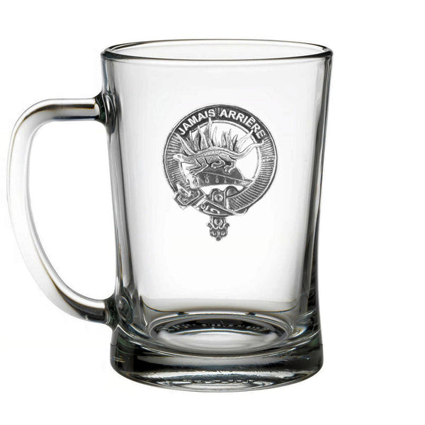 A clear glass mug with an embossed logo on it.