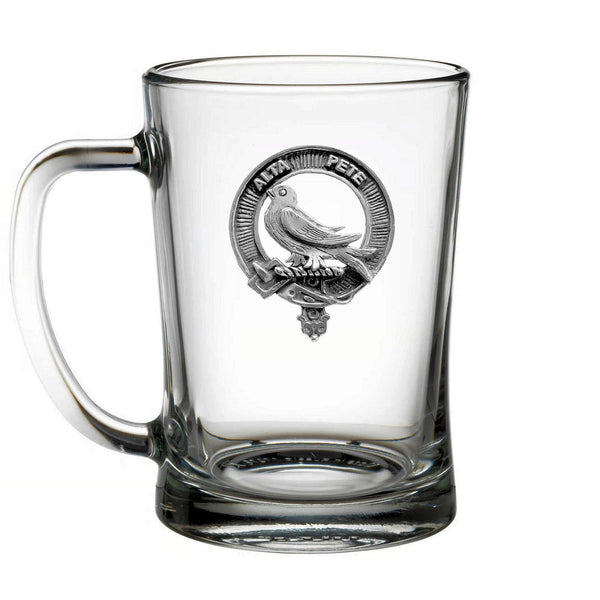 A clear glass mug with a silver emblem featuring a bird and the text "ALAM" inside a circular design.