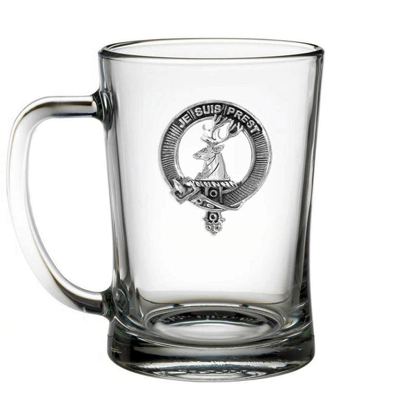 A clear glass mug with an embossed design featuring a deer and the text "JE GUP PRES" inside a circular emblem.