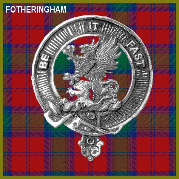 a metal emblem with a bird and a shield, set against a red and blue plaid background.
