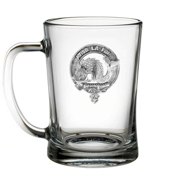 A clear glass mug with an embossed logo on it.