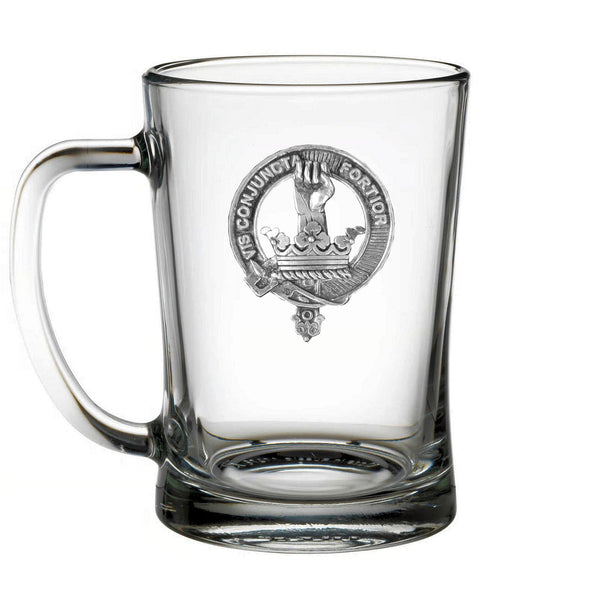 A clear glass mug with an embossed design on it.