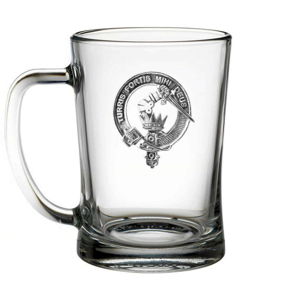 A clear glass mug with an embossed logo on it.