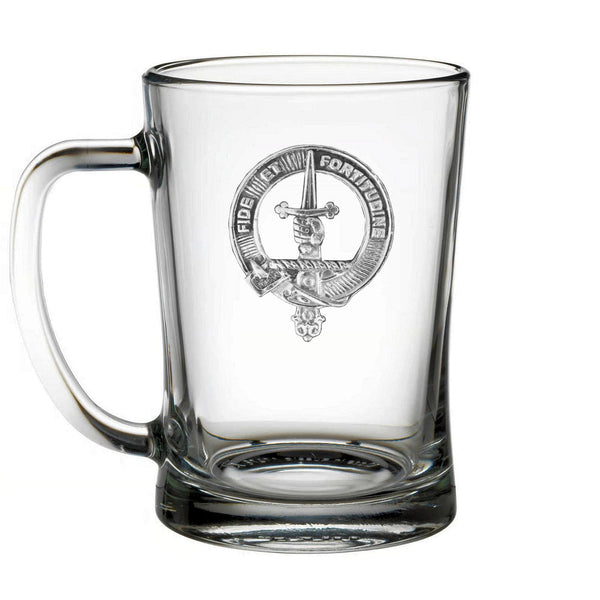 A clear glass mug with an embossed emblem featuring a sword and the words "FIDDLE" and "CARE" printed on it.