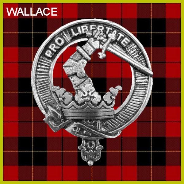 a metal emblem with a sword and a crown, set against a red and black plaid background.