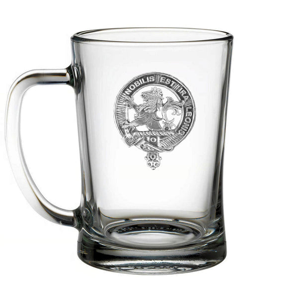 A clear glass mug with an embossed design on it.