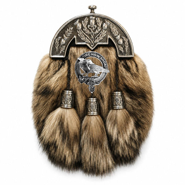 A fur-trimmed kilt with a metal emblem and tassels, displayed against a white background.